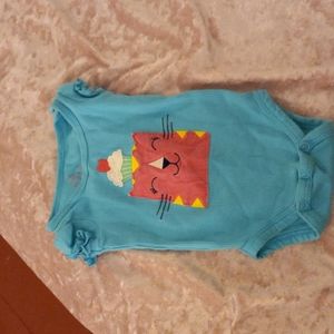 Light blue onesie with a cat picture on the front with a cupcake